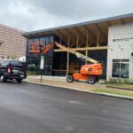 Sunray Window Films installation of 3M Prestige 20 and 70 Exterior Window Films at Resource Cleveland using a boom lift for high window access.