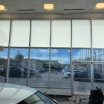 Interior showroom at Ken Ganley Volkswagen with Solyx Snow White Light Diffuser film installed for glare reduction and privacy.
