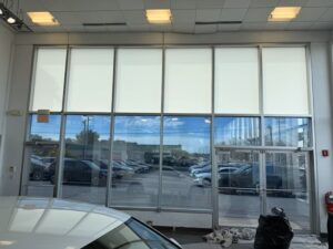 Interior showroom at Ken Ganley Volkswagen with Solyx Snow White Light Diffuser film installed for glare reduction and privacy.