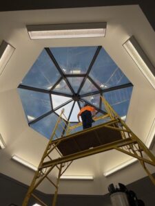 Skylight installation nearing completion with only a few 3M Affinity 15 panels remaining.
