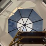 Sunray installer applying additional pieces of 3M Affinity 15 film to skylight panels.