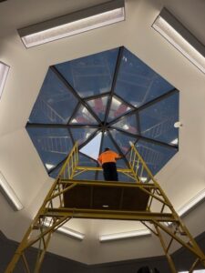 Installer completing the last piece of 3M Affinity 15 on the skylight at Cleveland Clinic Building 5.