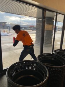 Sunray Window Films technician installing 3M Night Vision 25 window film inside Planet Fitness Mayfield Heights